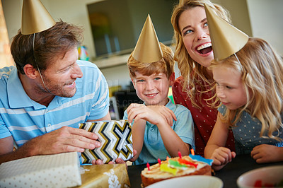 Buy stock photo Cropped shot of a happy family having a birthday party at home