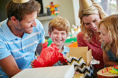 Buy stock photo Cropped shot of a happy family having a birthday party at home