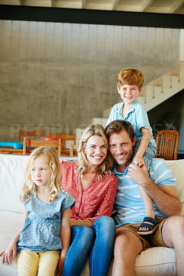 Buy stock photo Portrait of a happy family spending some quality time together at home