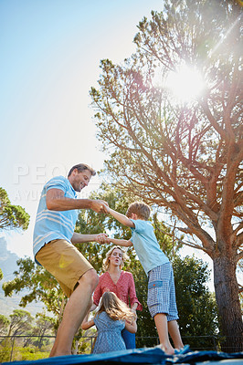 Buy stock photo Cropped shot of a family enjoying a day outdoors together