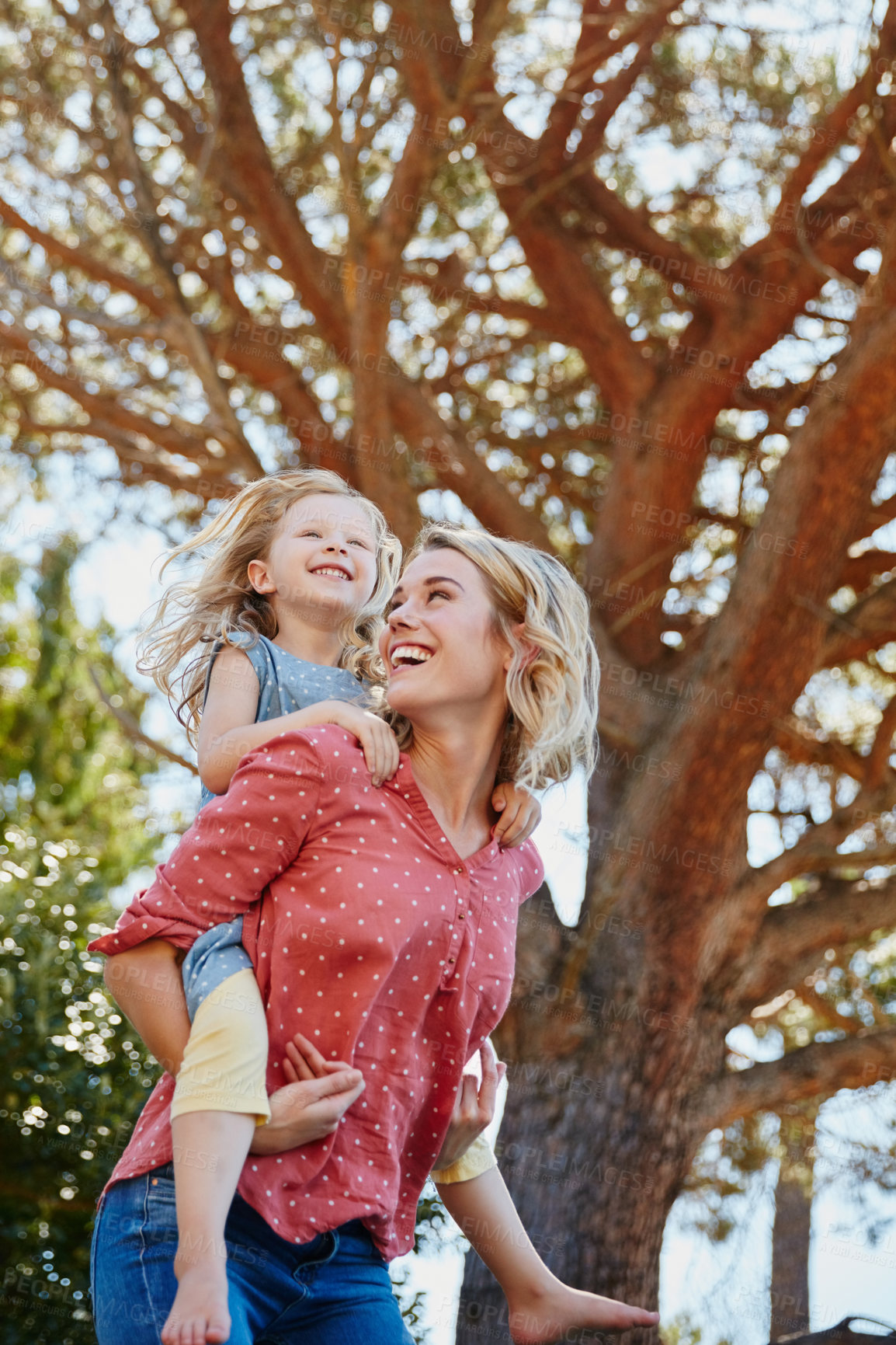 Buy stock photo Cropped shot of a mother and daughter enjoying a day outdoors together