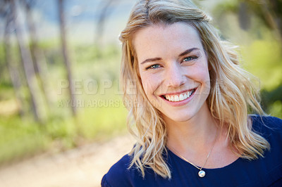 Buy stock photo Portrait of a beautiful young woman enjoying a day outside