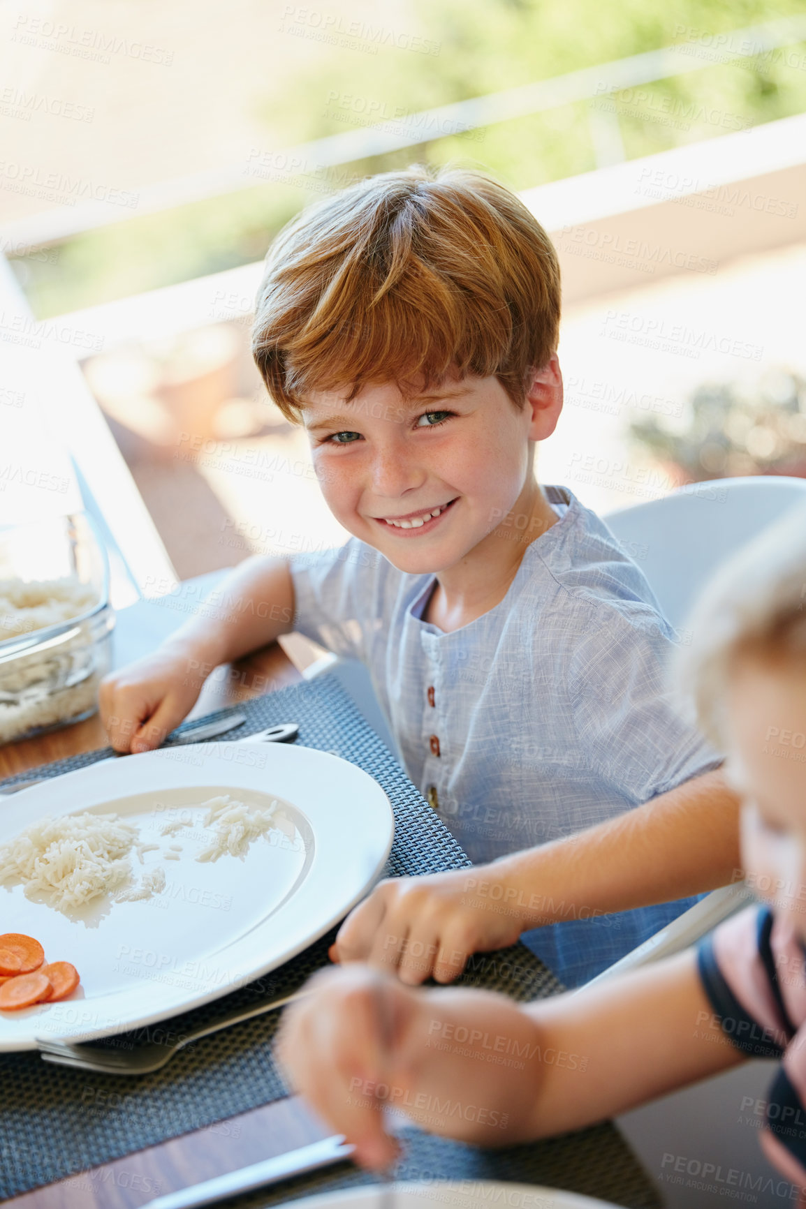 Buy stock photo Happy, lunch and portrait of child in home for eating, brunch and meal together for bonding. House, family and boy with food for nutrition, wellness and health for celebration, gathering or reunion