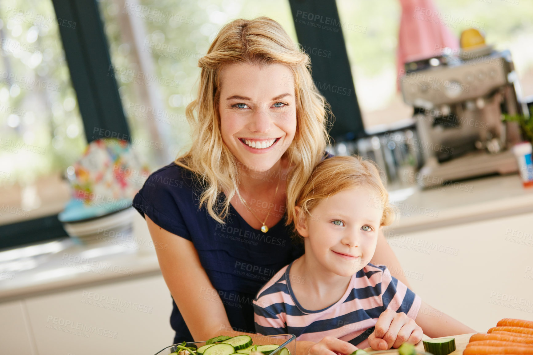 Buy stock photo Portrait of a mother and daughter preparing a meal together at home