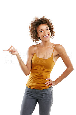 Buy stock photo Studio shot of an attractive young woman pointing towards something