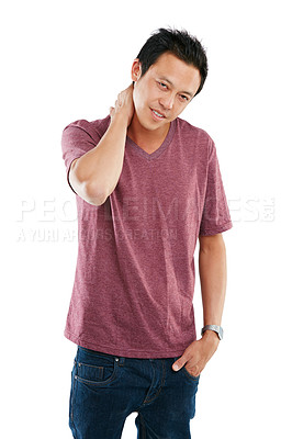 Buy stock photo Studio portrait of a young man rubbing his sore neck against a white background