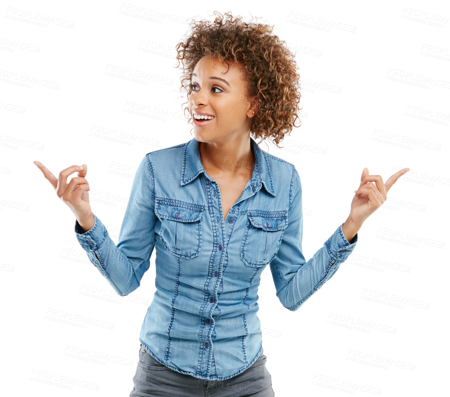 Buy stock photo Studio shot of an attractive young woman pointing in two different directions