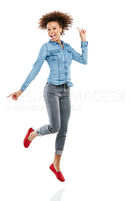 Buy stock photo Studio shot of an attractive young woman pointing in two different directions