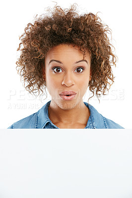 Buy stock photo Cropped shot of a young woman holding a placard