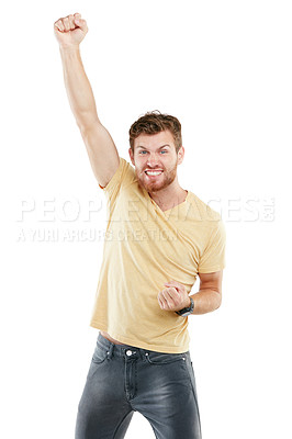 Buy stock photo Studio portrait of a young man punching the air triumphantly against a white background