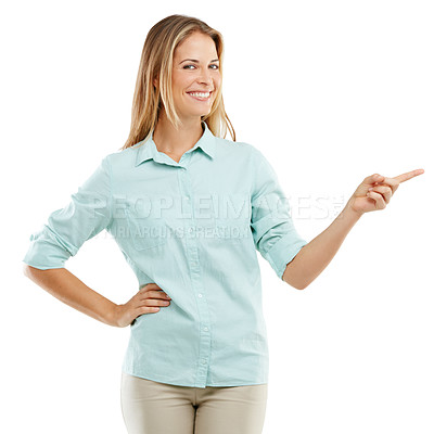 Buy stock photo Shot of a happy woman pointing at blank copyspace on a white background