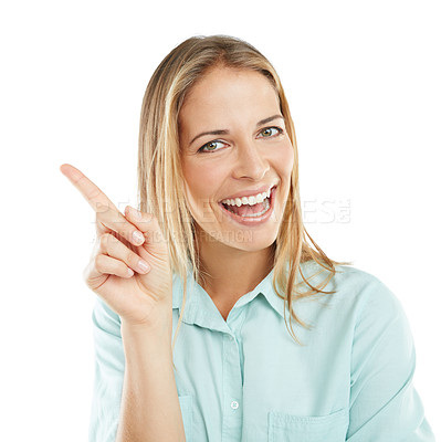 Buy stock photo Shot of a happy woman pointing at blank copyspace on a white background