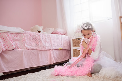 Buy stock photo Child, bedroom and princess costume or happy for dress up in home or playing pretend, game or development. Girl, crown and pink feathers with fashion in house with fairy wand, fantasy or preschool