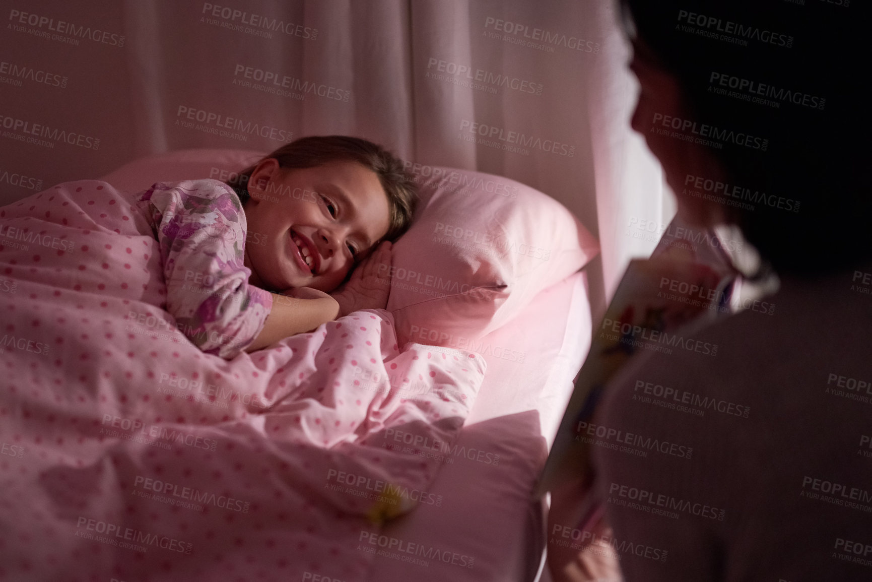 Buy stock photo Storytelling, mother and daughter in bed with book for bonding, relax and smile together in home. Comfort, mom and girl in bedroom for bedtime story, sleep and care with child development in house