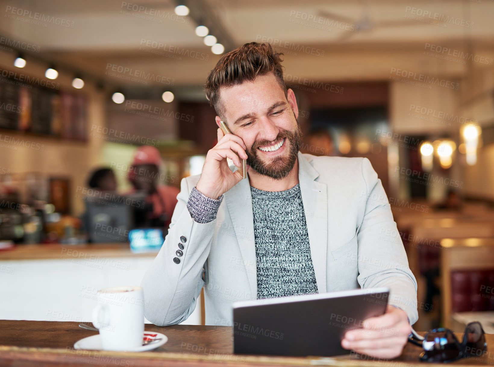 Buy stock photo Businessman, tablet and phone call in coffee shop for break, networking or consulting for sales in deli. Male person, smiling and working in restaurant for social media, communication or crm at diner