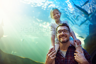 Buy stock photo Portrait of a father and his little daughter enjoying an outing to the aquarium