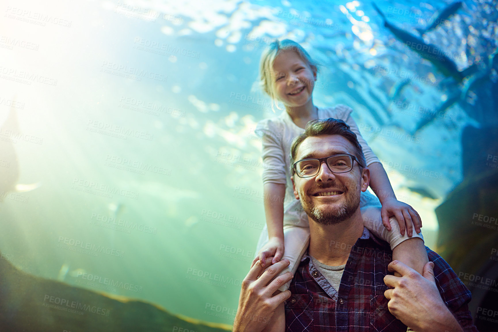 Buy stock photo Portrait of a father and his little daughter enjoying an outing to the aquarium