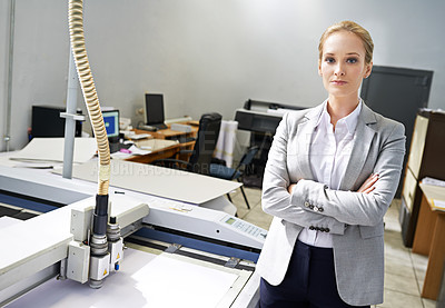 Buy stock photo Woman, publisher and machine at office with confidence for production, distribution and administration. Portrait, female person and entrepreneur with startup business in logistics and arms crossed 