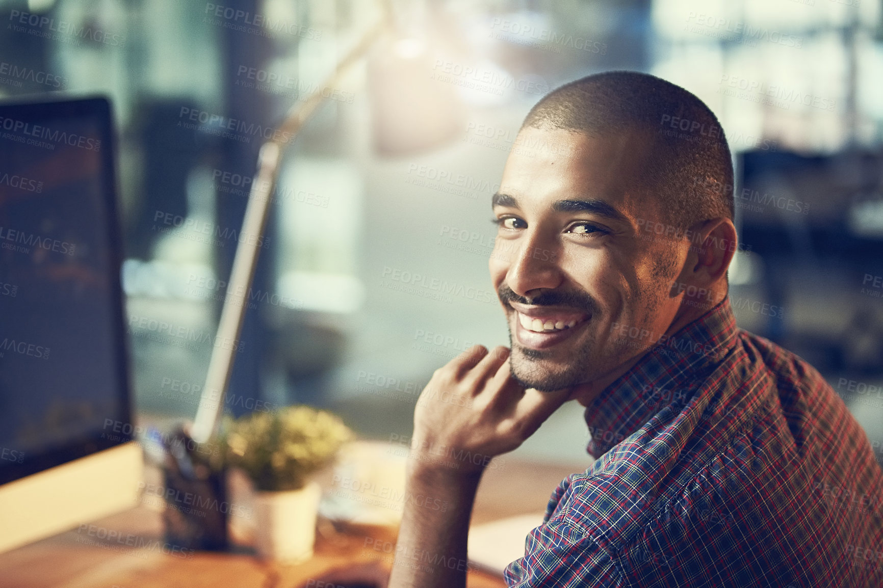 Buy stock photo Portrait of a young designer working late in an office