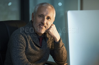 Buy stock photo Cropped portrait of a mature businessman working late at the office
