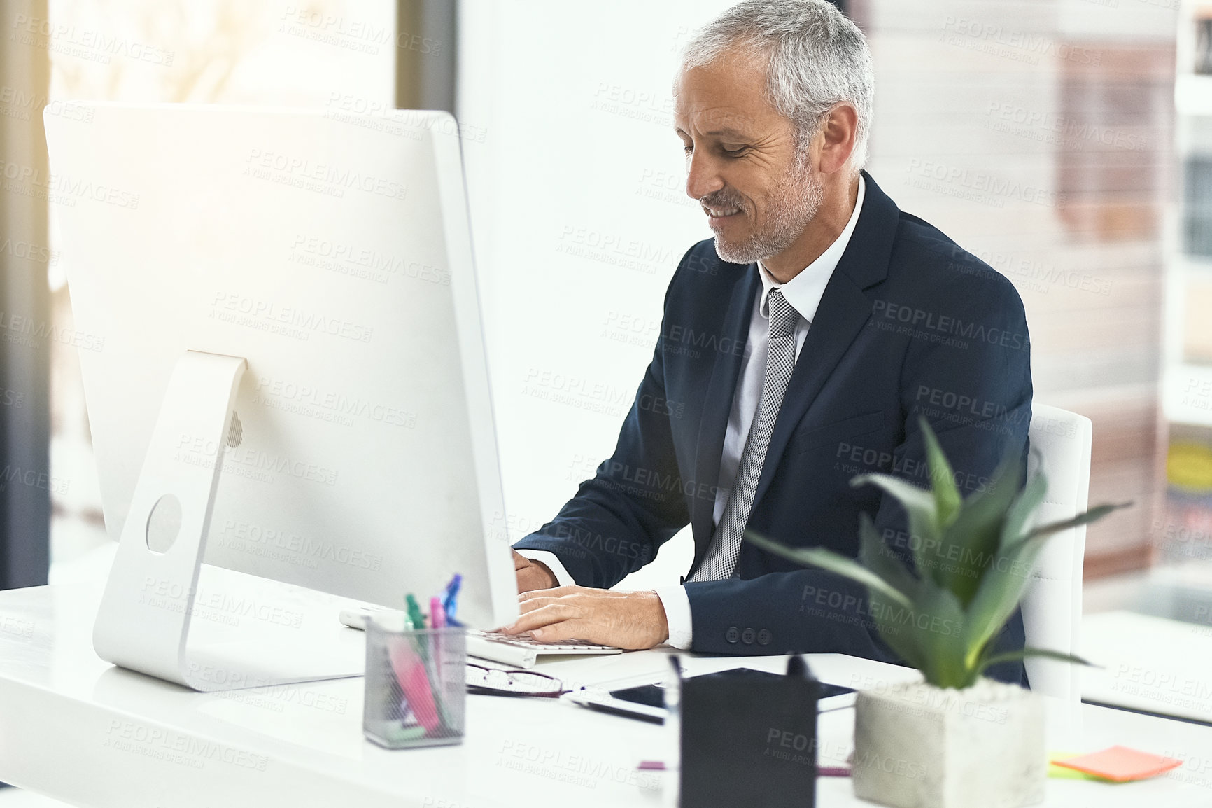 Buy stock photo Mature man, office and happy on computer for internet research, online and information as lawyer. Entrepreneur, pc and write email for connection, networking and legal advice or company growth