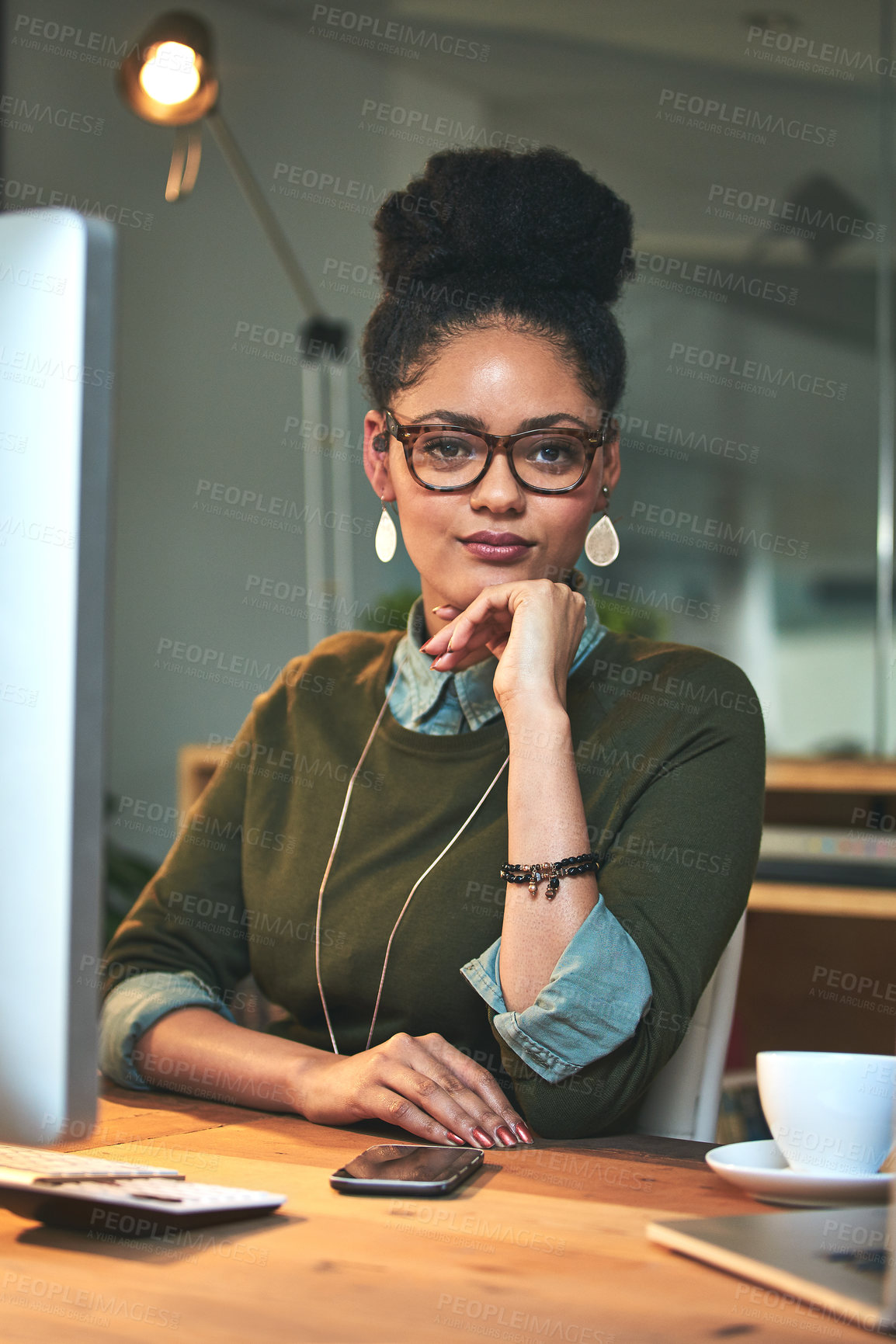 Buy stock photo Portrait of an attractive young woman working on her computer in the office
