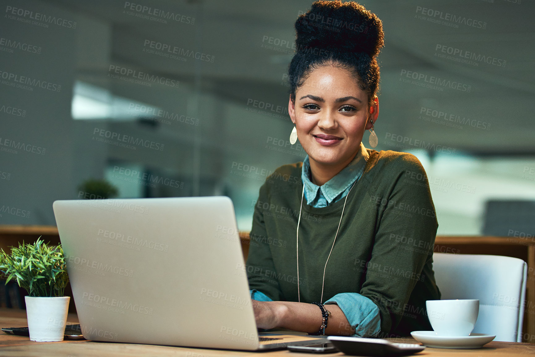 Buy stock photo Portrait of an attractive young woman working on her laptop in the office