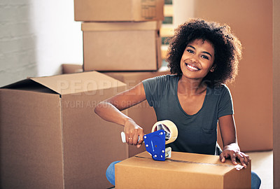 Buy stock photo Shot of a young woman busy moving house