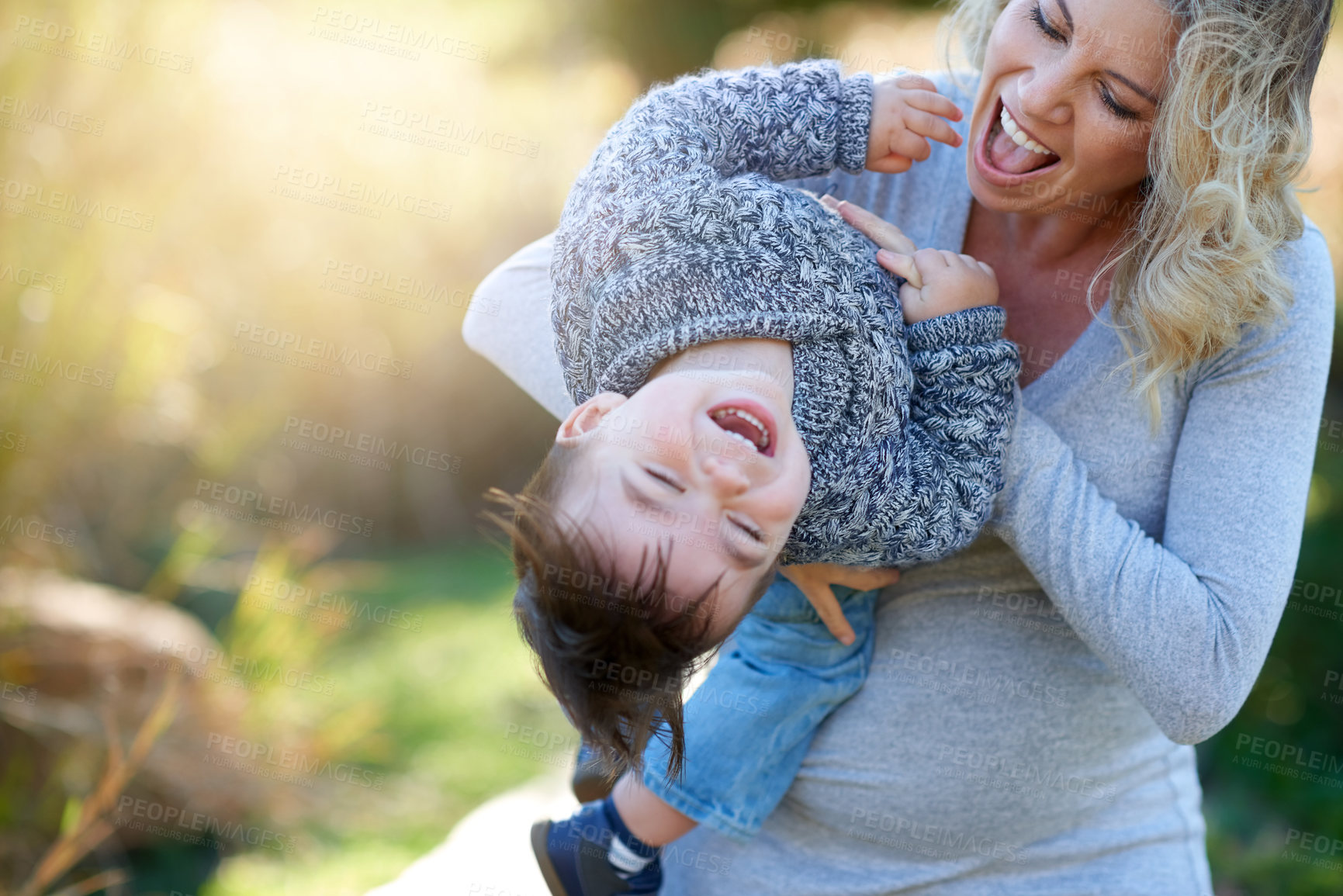 Buy stock photo Cropped shot of a mother bonding with her little boy outside