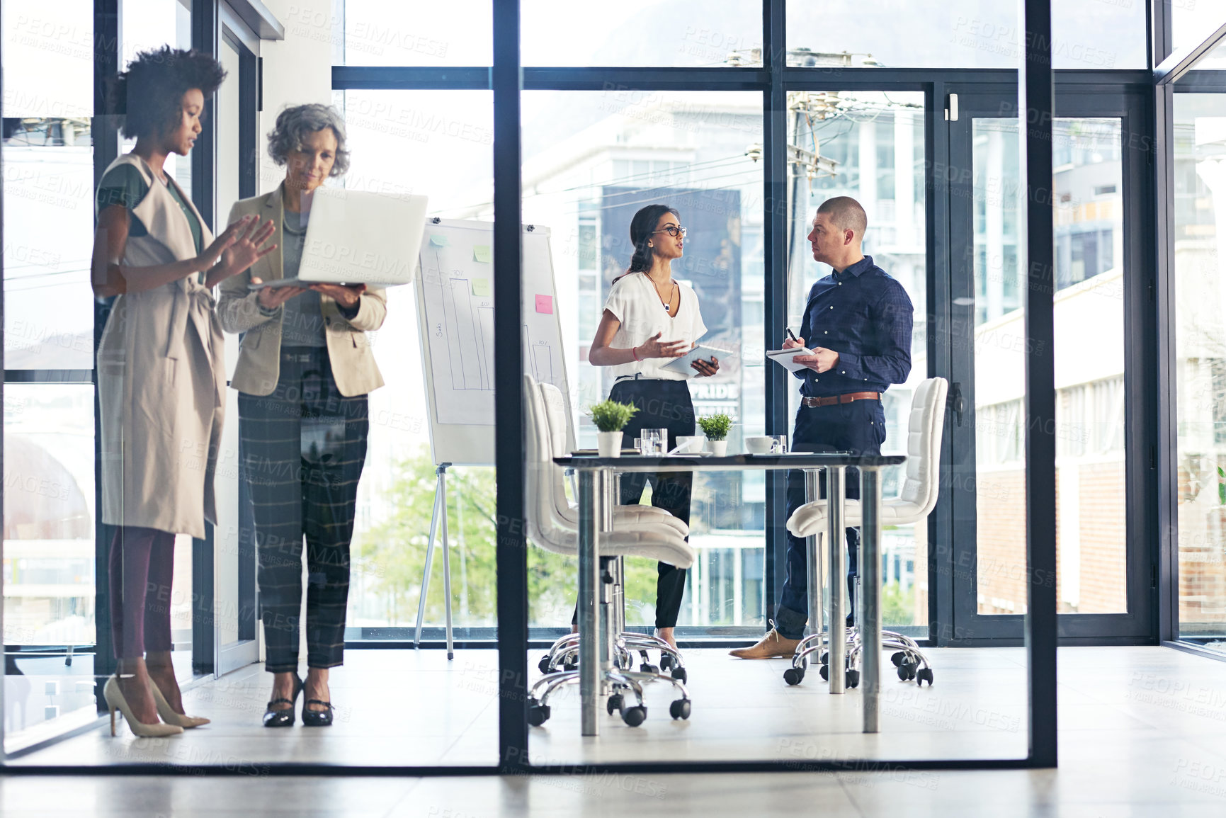 Buy stock photo Shot of businesspeople having a discussion in an office