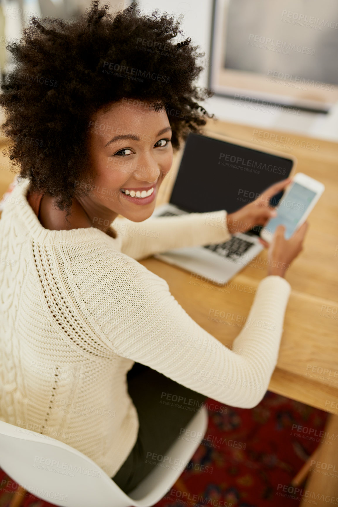 Buy stock photo Portrait of an attractive young using her cellphone and laptop at home