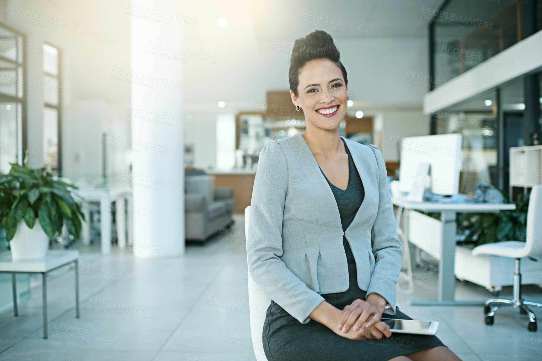 Buy stock photo Portrait of a happy businesswoman sitting in the office