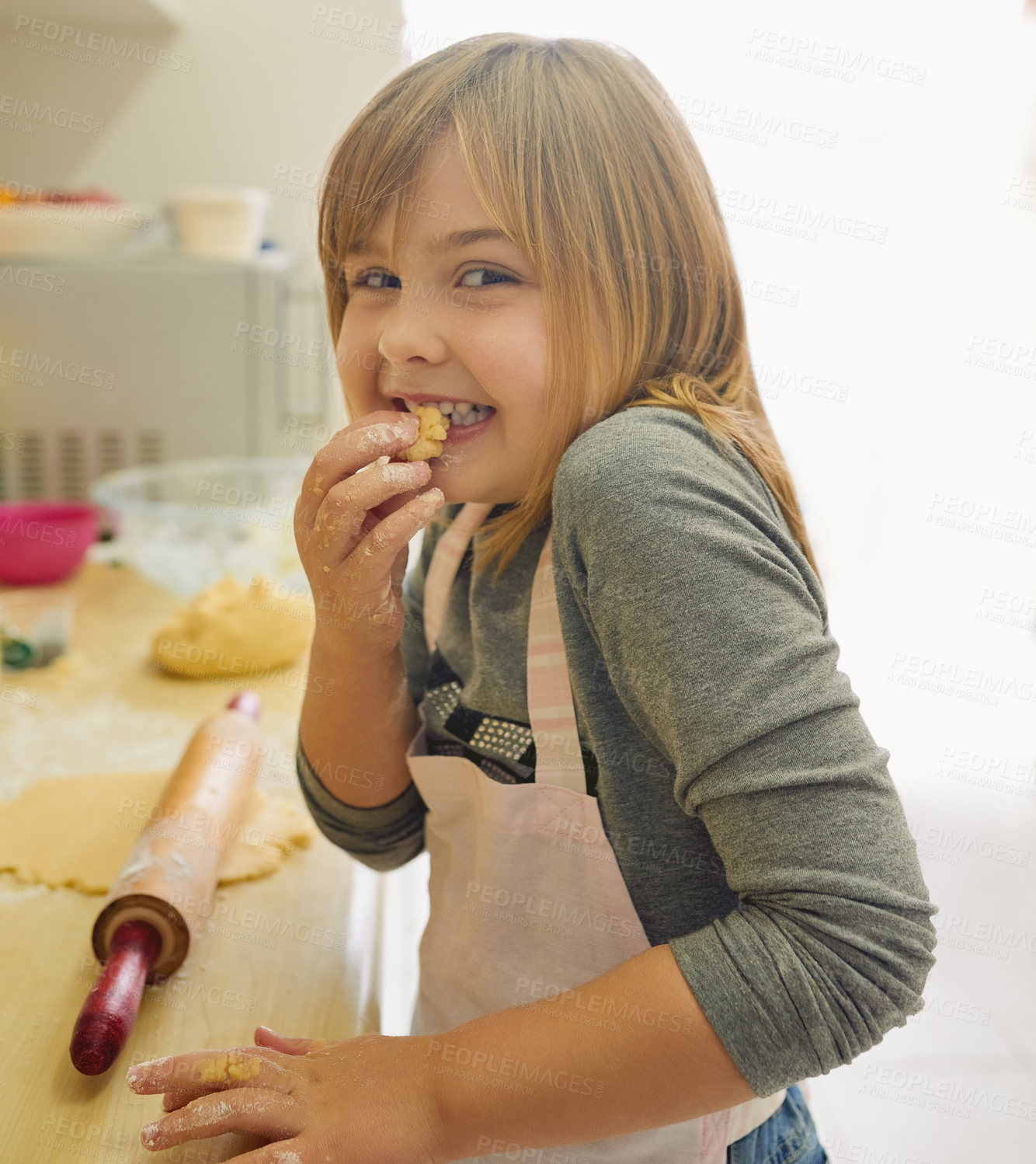 Buy stock photo Happy, young girl and learning to cook in portrait with dough and rolling pin for lesson in kitchen. Excited, female child and  baking education at home for growth, development and cooking skills