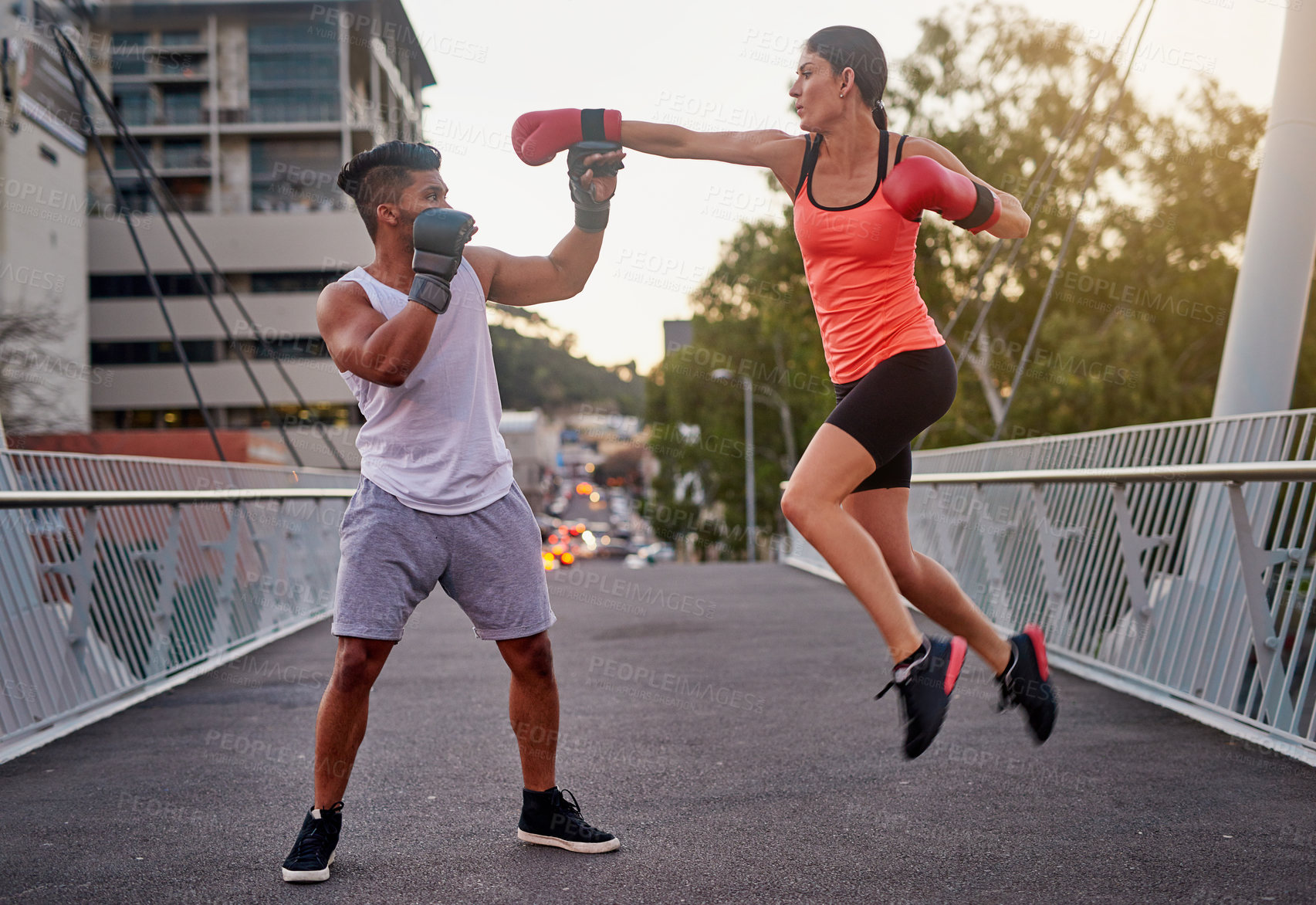 Buy stock photo Bridge, city and kickboxing fitness with couple outdoor together for self defense training. Exercise, hitting or punching with man and woman in urban town for combat sports or physical workout