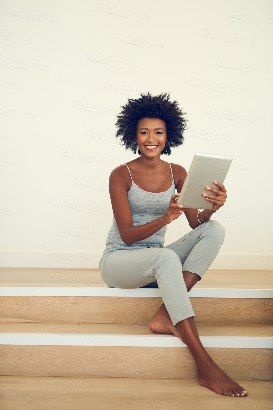 Buy stock photo Black woman, happy and portrait with tablet on stairs for entertainment, social media or internet blog. Technology, female person and smile with confidence in home for online sharing and connectivity