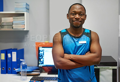 Buy stock photo Portrait of a personal trainer standing in his office at the gym
