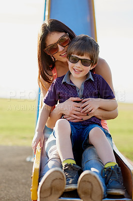 Buy stock photo Portrait of a mother and son enjoying a day at the park together