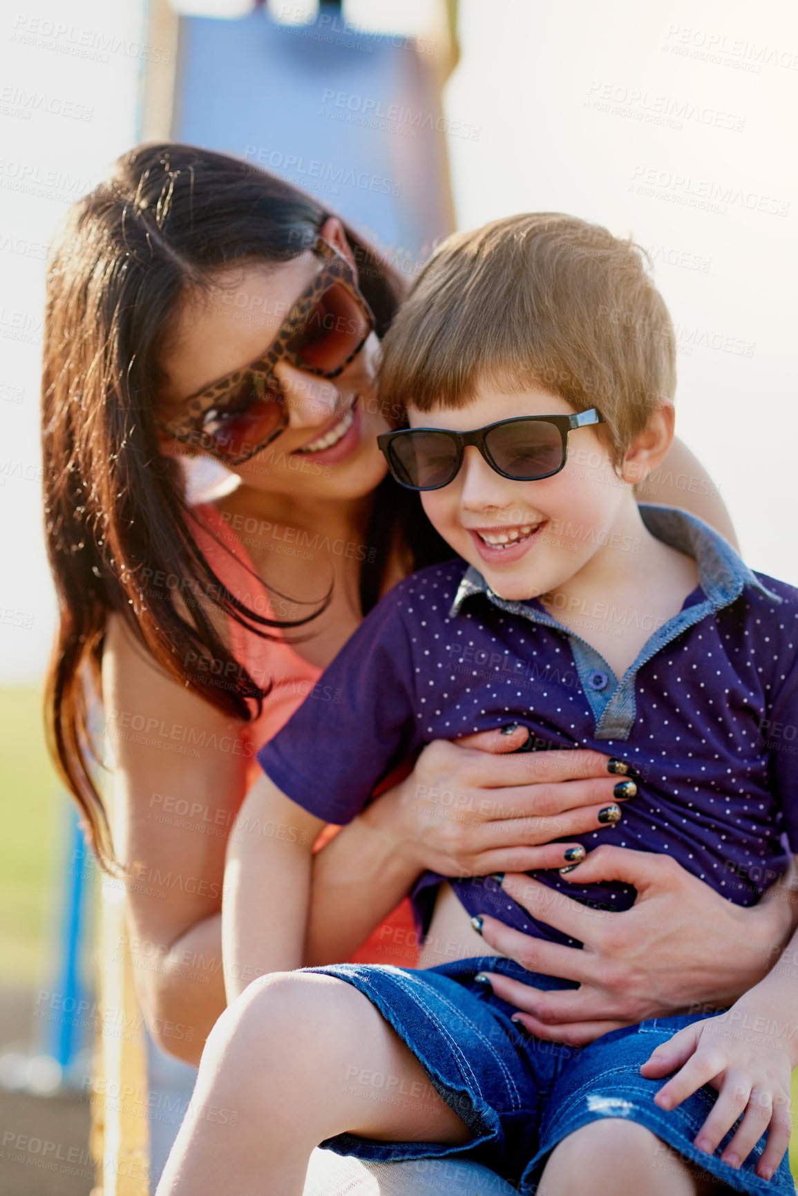 Buy stock photo Woman, child and slide in playground for play, fun and park in summer. Boy, mother and parent with children in sunglasses and weekend activity, outing and together for relax and childhood development