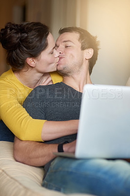 Buy stock photo Couple, kiss and laptop on sofa with love or bonding for romance with streaming videos, comedy shows and online. Man, woman and relax together in home with digital technology for movies and happiness