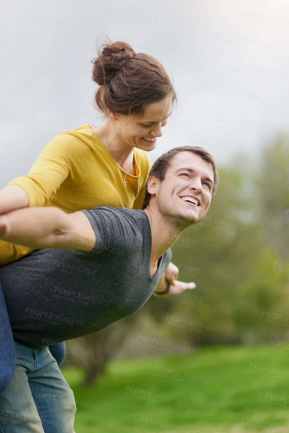 Buy stock photo Couple, happiness and piggyback in nature for love, trust and marriage in garden for holiday. Man, woman and fun outdoor for vacation, adventure and smile for anniversary, quality time and date