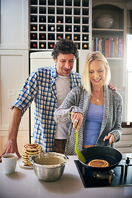 Buy stock photo Happy, couple and baking in kitchen with love for breakfast  to support bonds, teamwork and unity as a team. Woman, man and creative cooking skills at house with romance, trust and share interest 