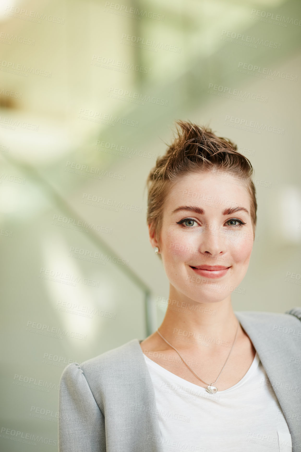 Buy stock photo Portrait of a young businesswoman standing in an office