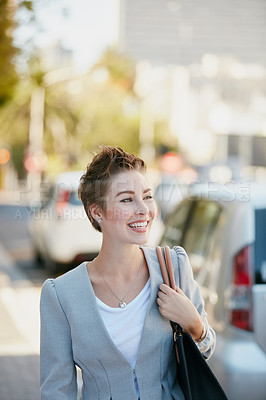 Buy stock photo Cropped shot of a young businesswoman on the move in the city