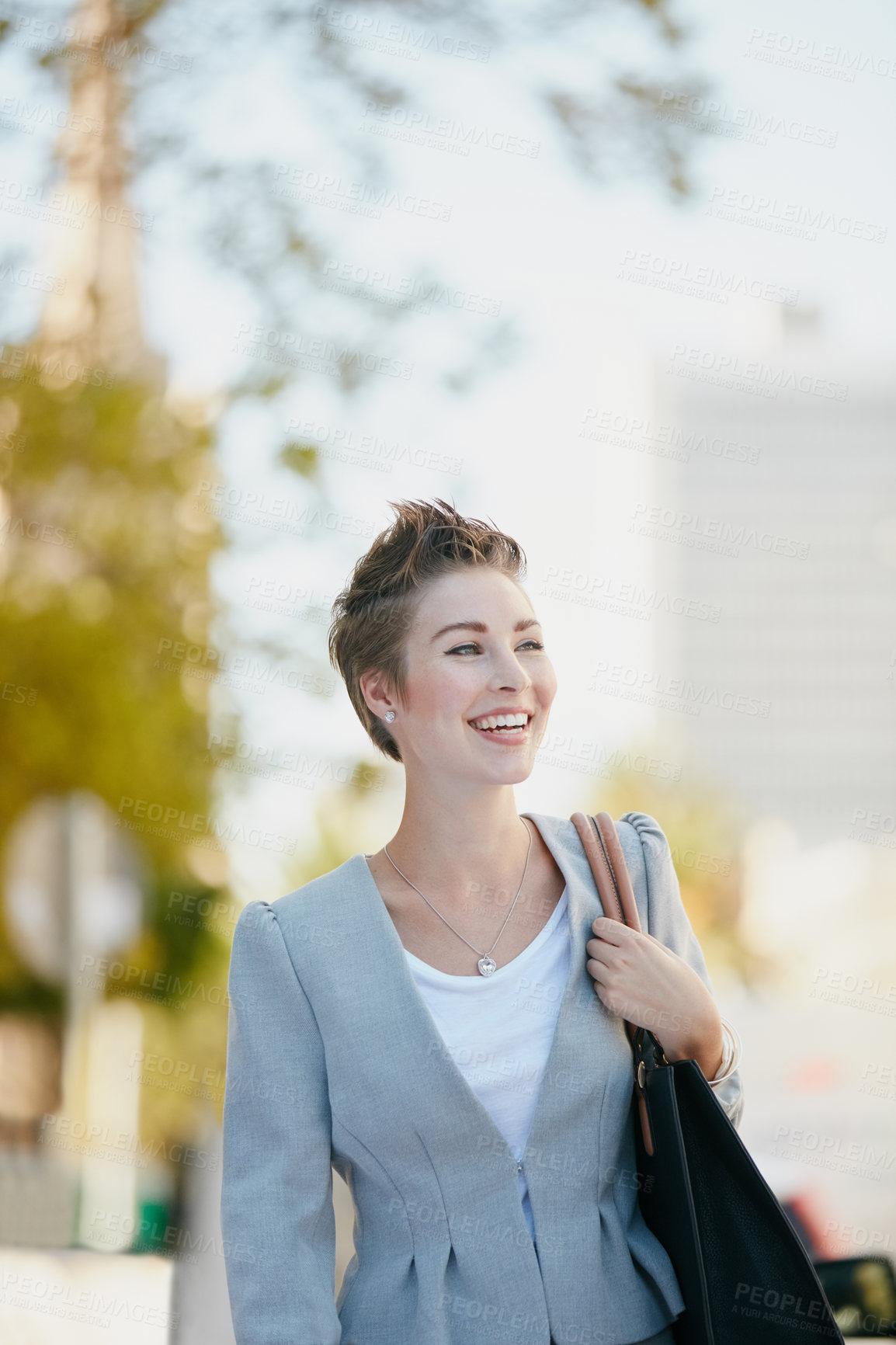 Buy stock photo Cropped shot of a young businesswoman on the move in the city