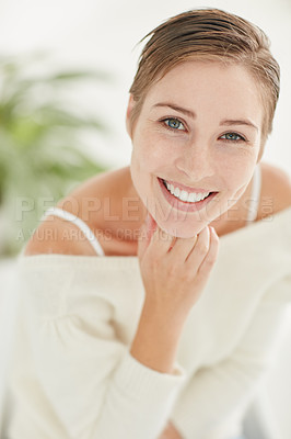Buy stock photo Portrait of a smiling young woman alone at home