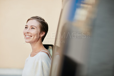 Buy stock photo Portrait of a smiling young woman standing outside