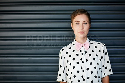 Buy stock photo Portrait of a trendy young woman standing against a corrugated background