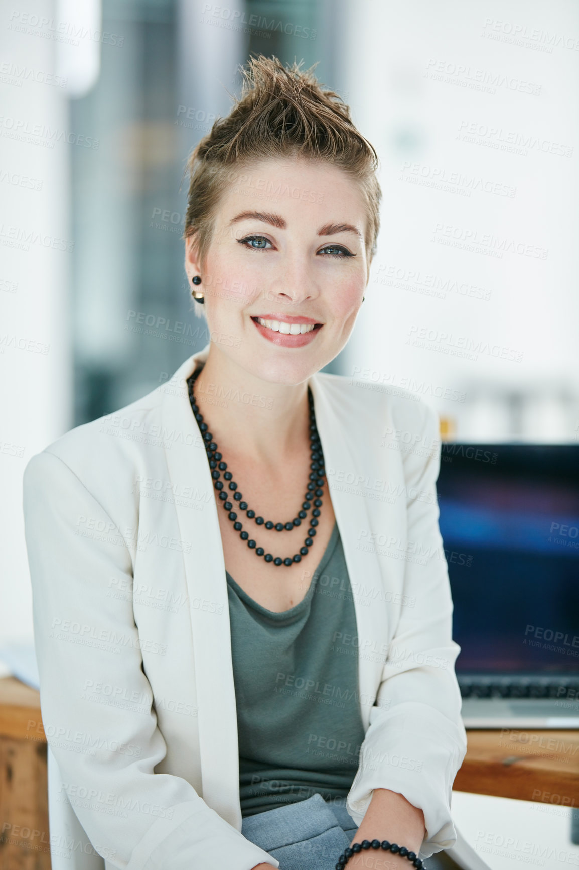 Buy stock photo Portrait of a young businesswoman sitting in an office