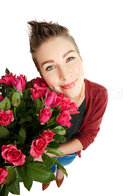 Buy stock photo Studio portrait of a happy young woman holding a bouquet of flowers against a white background