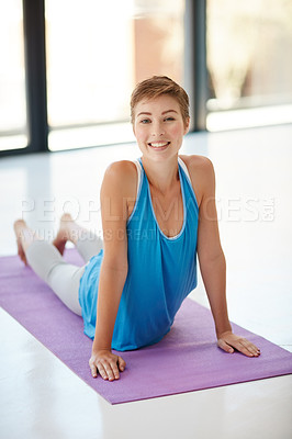 Buy stock photo Woman, portrait smile and stretching on yoga mat for healthy fitness, spiritual wellness or zen workout indoors. Happy female yogi in warm stretch smiling in happiness for exercise or pilates at gym